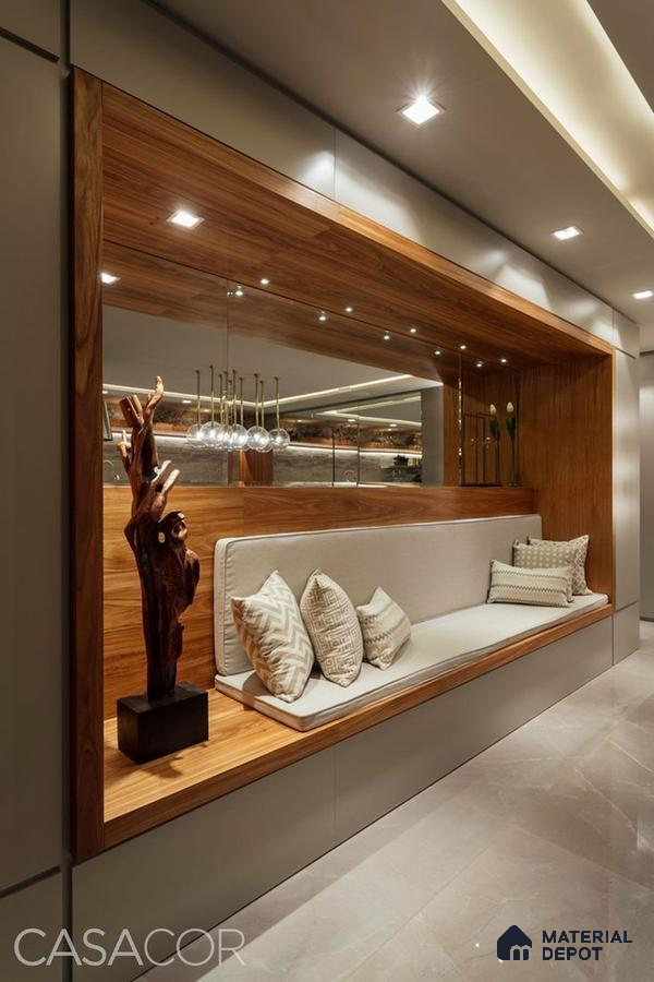 A bathroom with a large tub in the middle of the room and two windows overlooking the city at night time area, next to a window filled with lots of the city at night time Space in the background